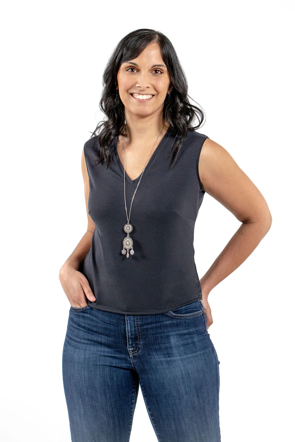 front view of sustainable sleeveless professional black blouse and jeans